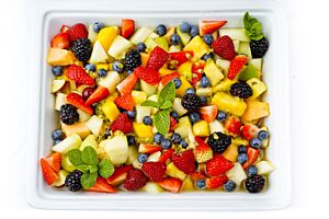 Large Bowl of Exotic Fruit Salad with Passion Fruit Drizzle